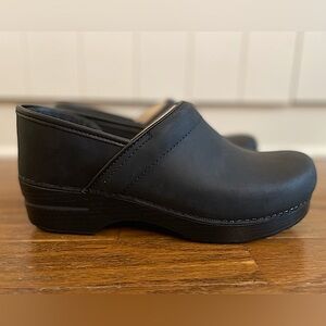 Dansko women’s size 40 (9-9.5) black oiled leather clogs. Brand new- NEVER WORN.